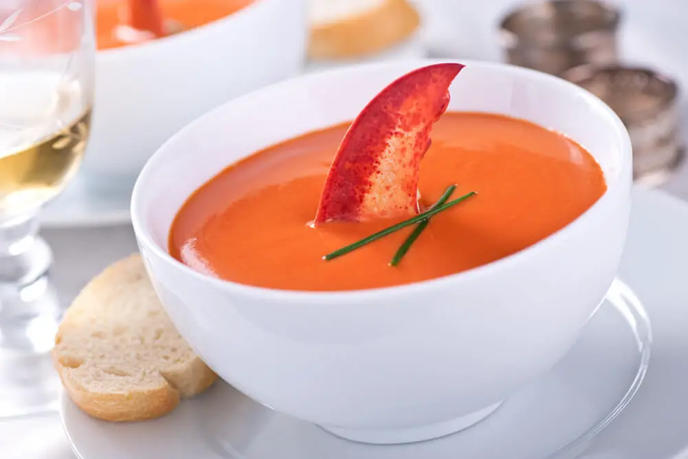 Lobster bisque served in a white bowl
