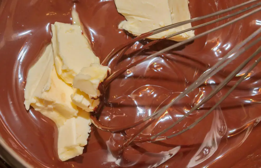 adding butter to dark chocolate