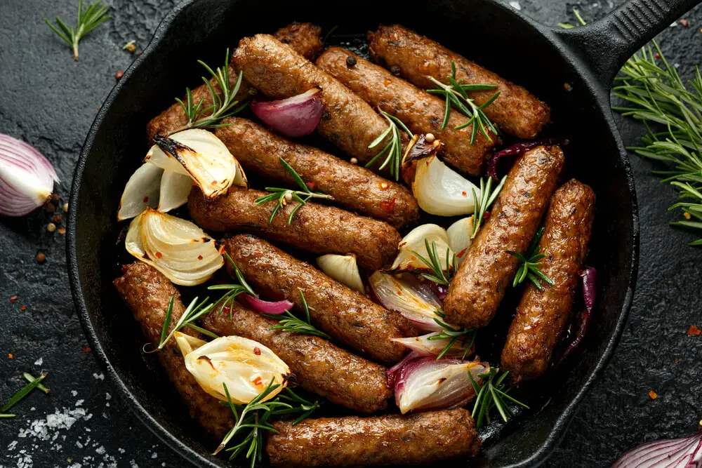 just cooked sausages in a skillet ready to serve