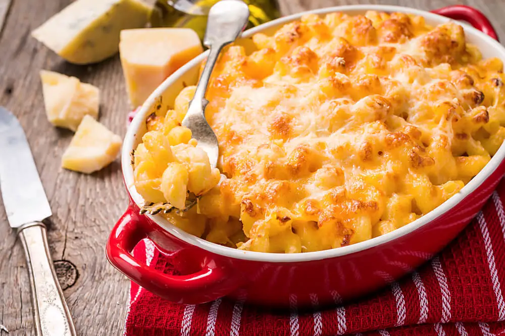 closeup view of delicious mac and cheese inside  a red bowl 