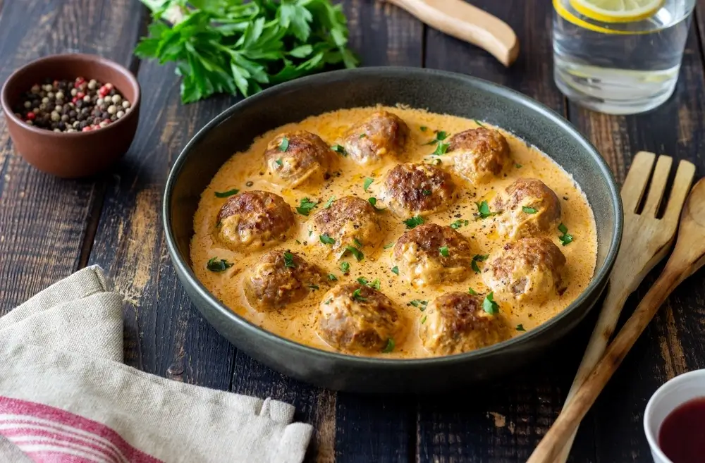 cooked meatballs and sauce in a bowl
